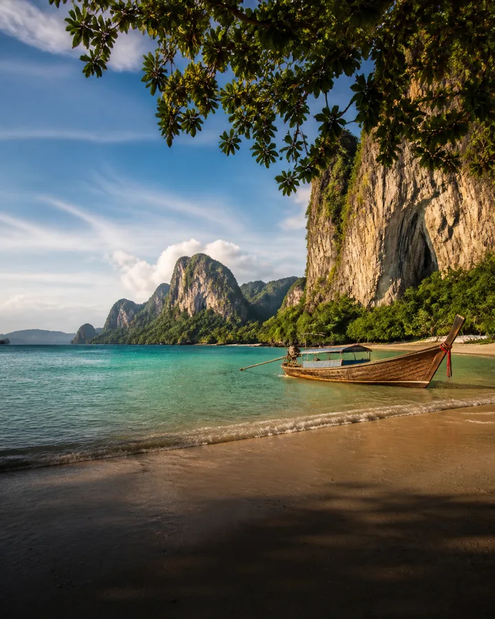 Railay Beach limestone cliffs and long-tail boat